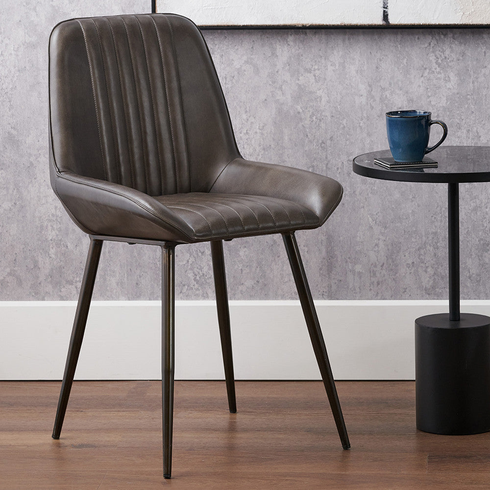 Upholstered in Vintage Dark Brown Leather with ribbed back cushioning. Vintage style and modern functionality. A refined addition to any dining setting or living space. Available today at www.nobleandnook.co.uk