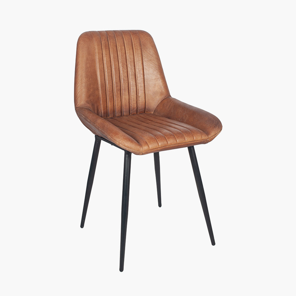 Upholstered in Vintage Brown Leather with ribbed back cushioning. Vintage style and modern functionality. A refined addition to any dining setting or living space. Available today at www.nobleandnook.co.uk