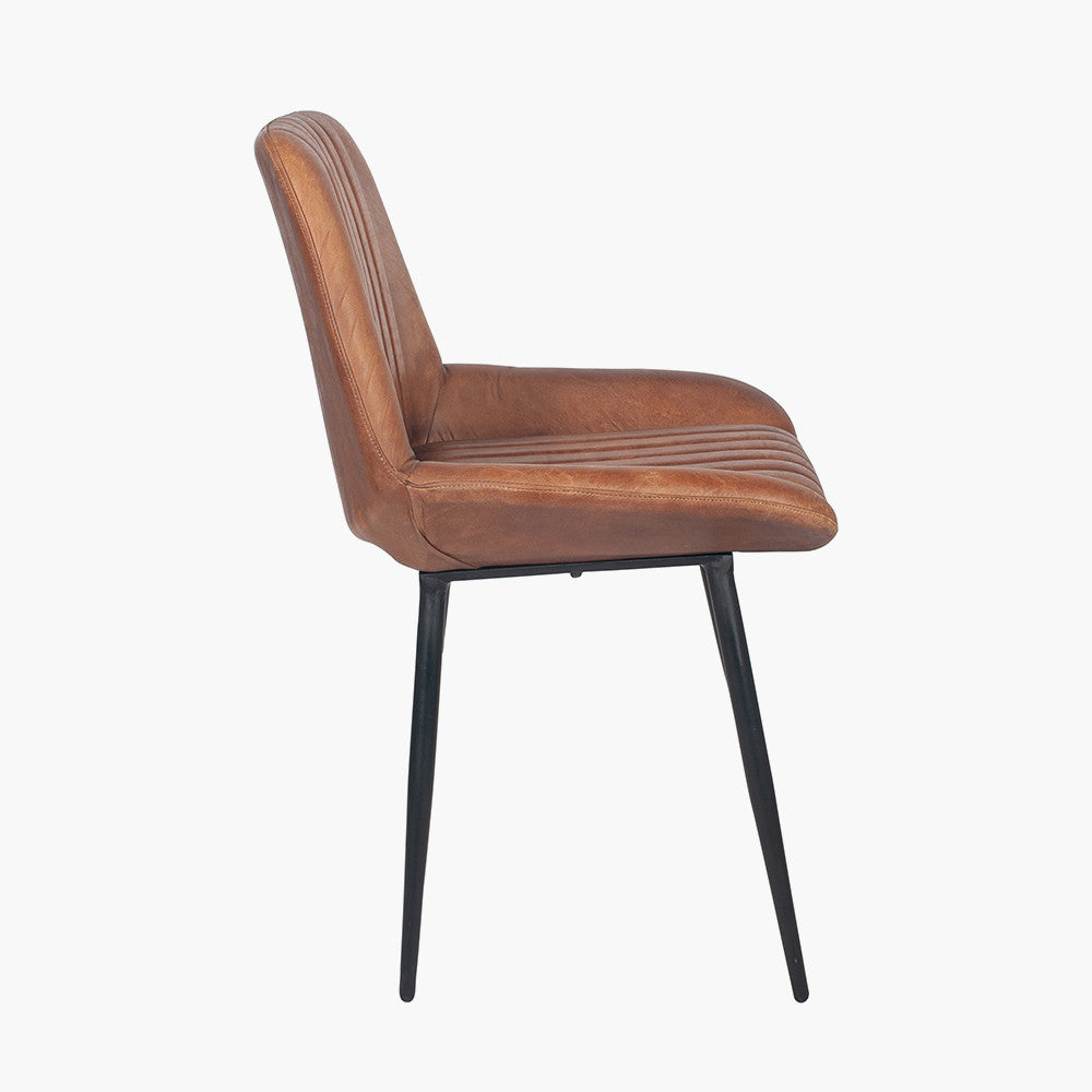 Upholstered in Vintage Brown Leather with ribbed back cushioning. Vintage style and modern functionality. A refined addition to any dining setting or living space. Available today at www.nobleandnook.co.uk