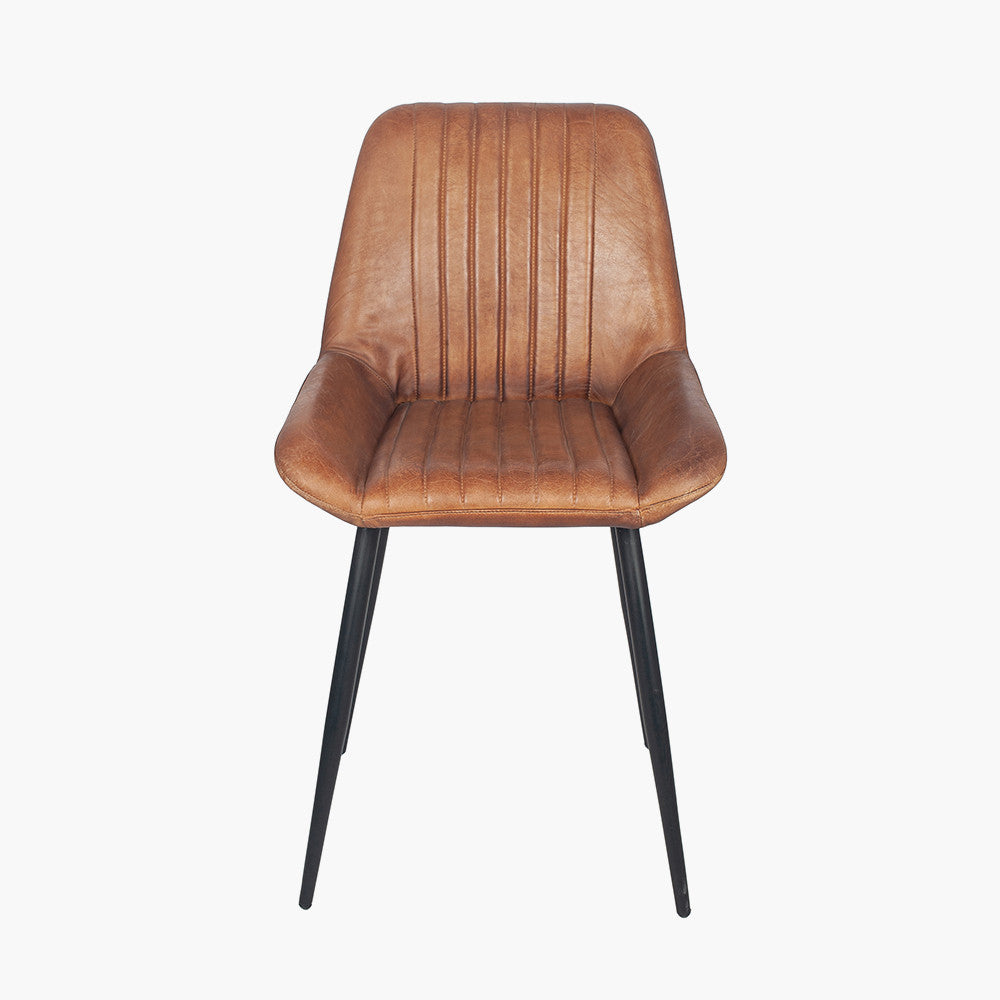 Upholstered in Vintage Brown Leather with ribbed back cushioning. Vintage style and modern functionality. A refined addition to any dining setting or living space. Available today at www.nobleandnook.co.uk