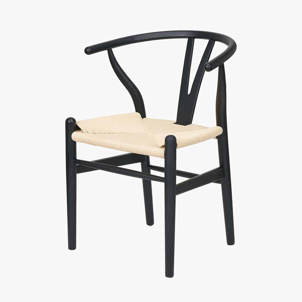 Shop the Quinn Dining Chair with the woven natural paper rope seat and finished in a contemporary black colour. Shop online now at www.nobleandnook.co.uk