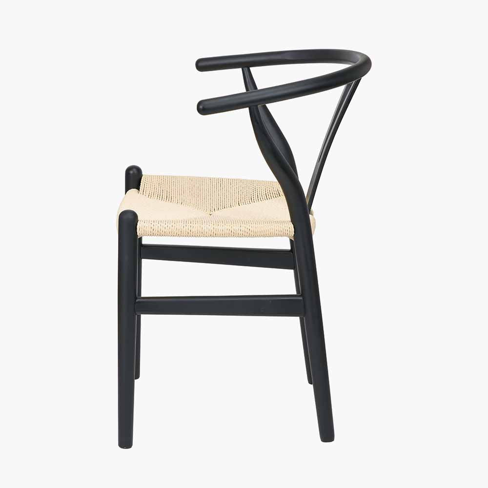 Shop the Quinn Dining Chair with the woven natural paper rope seat and finished in a contemporary black colour. Shop online now at www.nobleandnook.co.uk