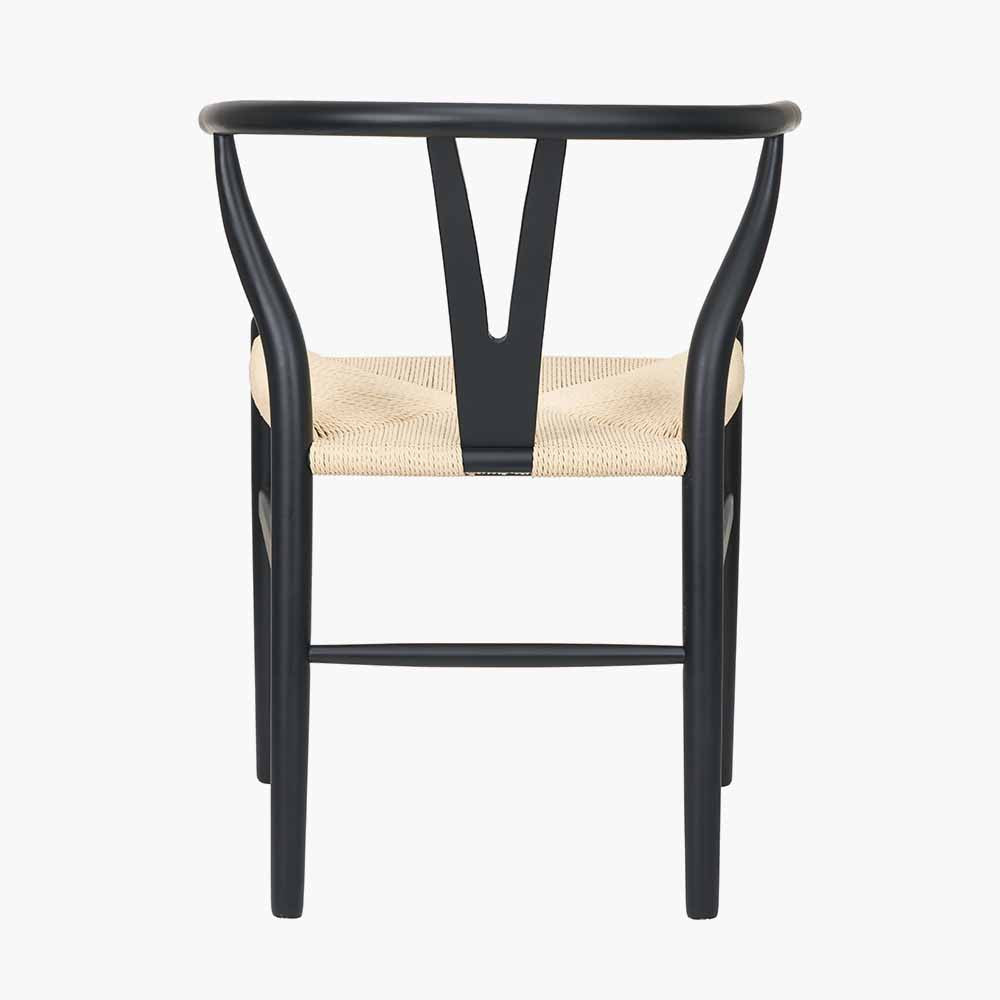 Shop the Quinn Dining Chair with the woven natural paper rope seat and finished in a contemporary black colour. Shop online now at www.nobleandnook.co.uk