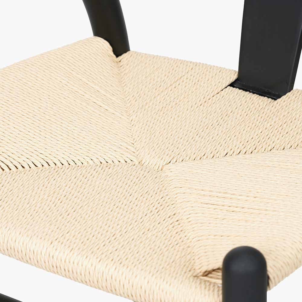 Shop the Quinn Dining Chair with the woven natural paper rope seat and finished in a contemporary black colour. Shop online now at www.nobleandnook.co.uk
