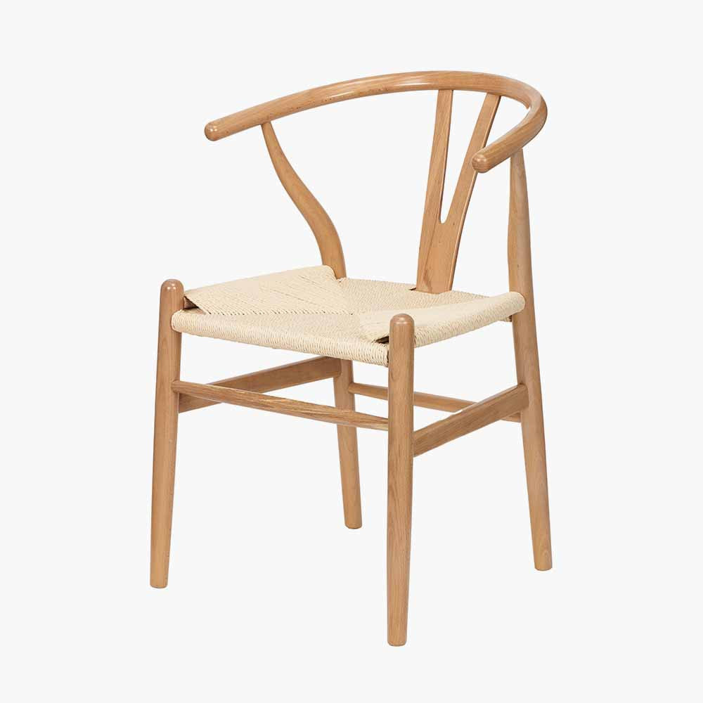 Shop the Quinn Dining Chair crafted from beech wood and finished in beautiful natural hue with a woven natural rope seat. Shop online now at www.nobleandnook.co.uk
