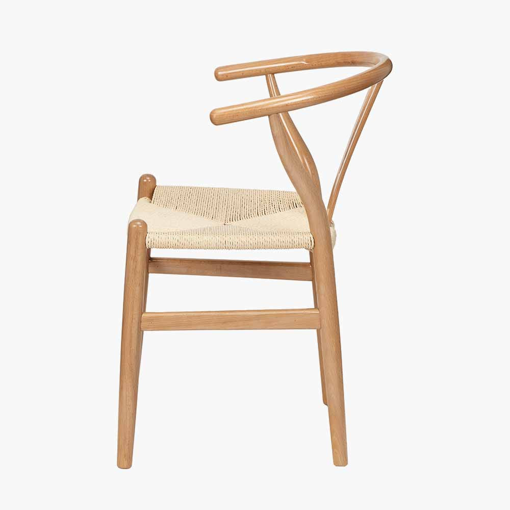 Shop the Quinn Dining Chair crafted from beech wood and finished in beautiful natural hue with a woven natural rope seat. Shop online now at www.nobleandnook.co.uk