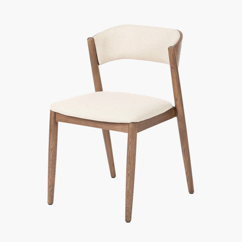 Shop the Elias Dining Table and 6 matching Chairs, blending minimalist elegance with Scandinavian-inspired design. Expertly crafted from solid ash wood with a stylish on-trend dark finish. Shop online today at www.nobleandnook.co.uk