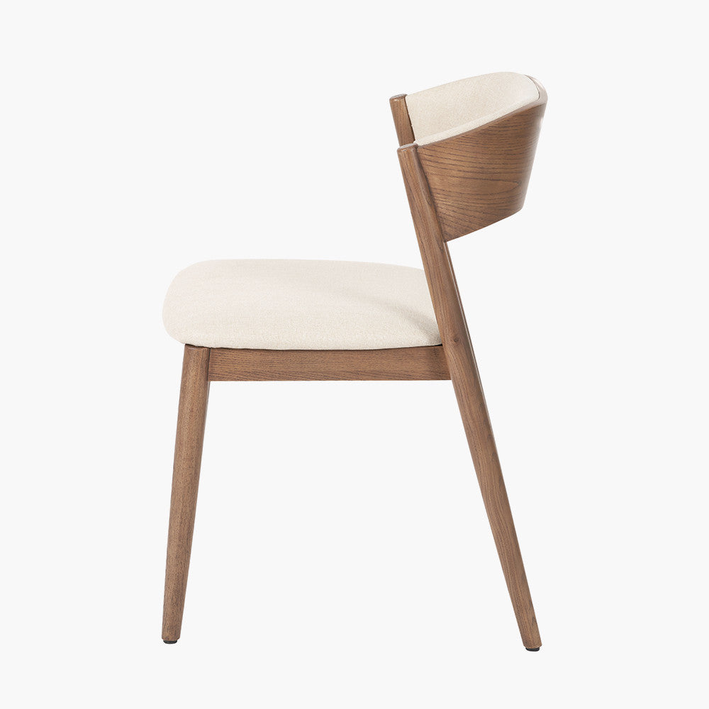 Shop the Elias Dining Table and 6 matching Chairs, blending minimalist elegance with Scandinavian-inspired design. Expertly crafted from solid ash wood with a stylish on-trend dark finish. Shop online today at www.nobleandnook.co.uk