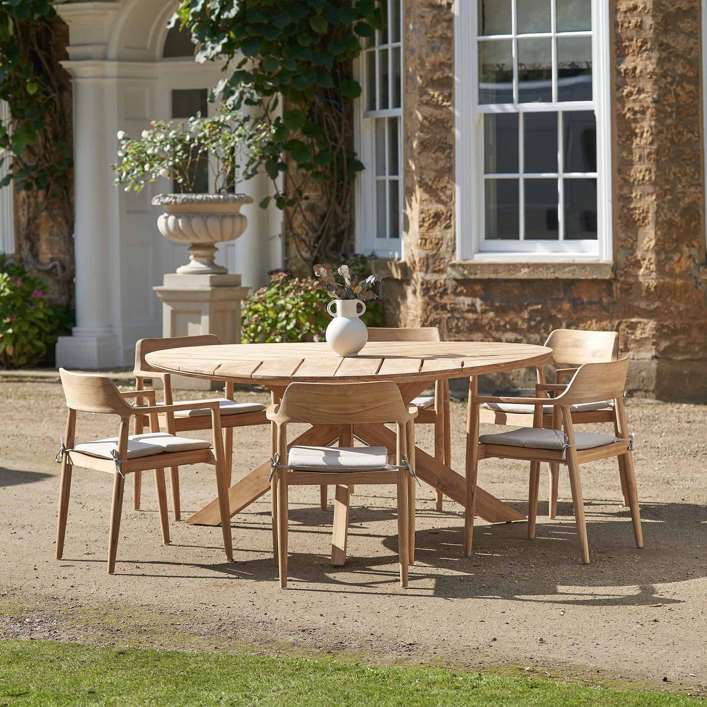 Elevate your outdoor dining experience with the Reuleaux 6 Seater Outdoor Dining Set, expertly crafted from premium teak wood for durability and timeless style. Shop online today at www.nobleandnook.co.uk