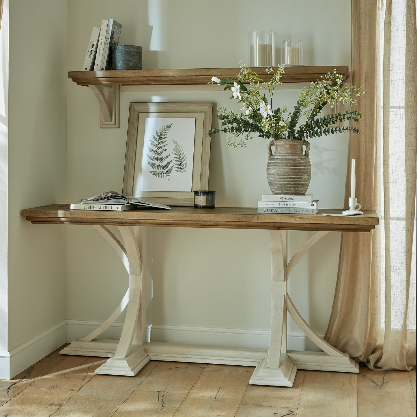 Shop the Luna Console Table featuring natural wood grain and an off-white painted base to create a striking contrast. The perfect balance of rustic charm and contemporary appeal. Shop online today at www.nobleandnook.co.uk
