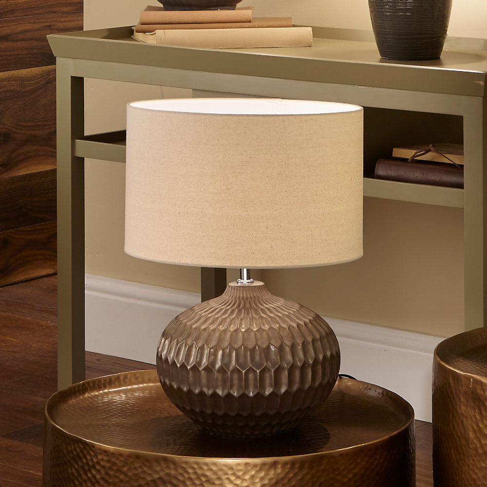 Shop the Cassius Bronze Table Lamp with a layered bronze ceramic base and hand-applied metallic finish. FREE UK MAINLAND DELIVERY. Shop online now at www.nobleandnook.co.uk
