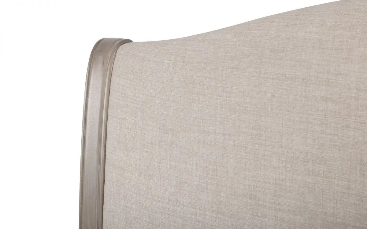 Shop a classic French design. The frame is finished in a limed oak effect, a soft upholstered headboard covered in an oatmeal linen fabric. Shop online today at www.nobleandnook.co.uk
