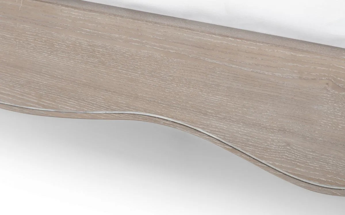 Shop a classic French design. The frame is finished in a limed oak effect, a soft upholstered headboard covered in an oatmeal linen fabric. Shop online today at www.nobleandnook.co.uk