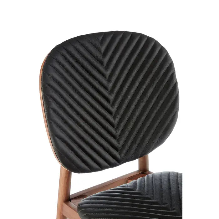A statement piece, the Kenso Dining Chair blends vintage sophistication with contemporary craftsmanship, featuring a solid walnut frame, genuine leather seat. Shop online today at www.nobleandnook.co.uk