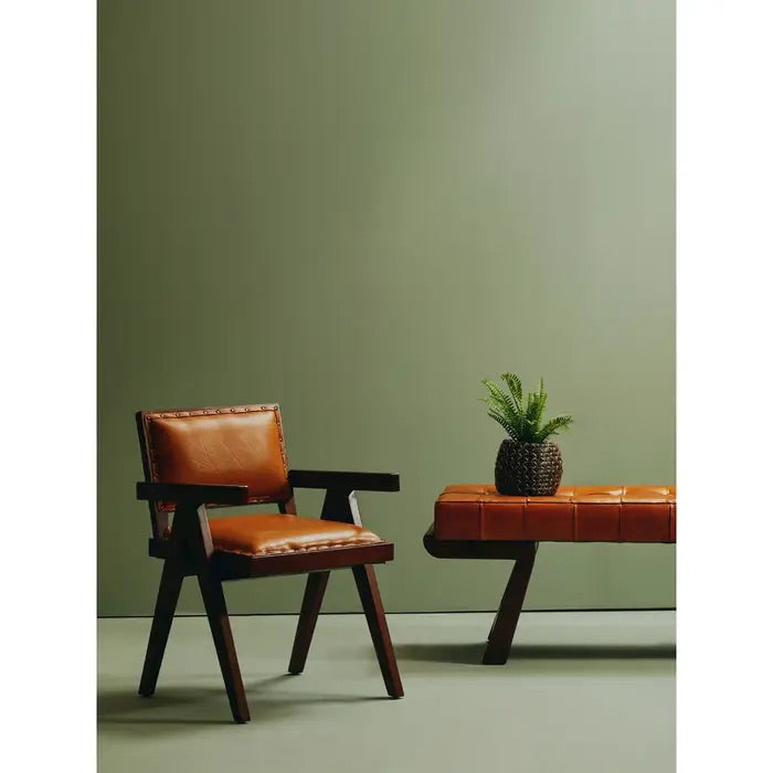 Add refined style to your space with the Andean small armchair. A teak wooden frame, upholstered in soft tan genuine leather and finished with metallic stud detailing. Shop online today at www.nobleandnook.co.uk