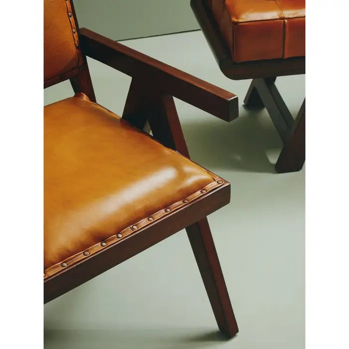 Add refined style to your space with the Andean small armchair. A teak wooden frame, upholstered in soft tan genuine leather and finished with metallic stud detailing. Shop online today at www.nobleandnook.co.uk