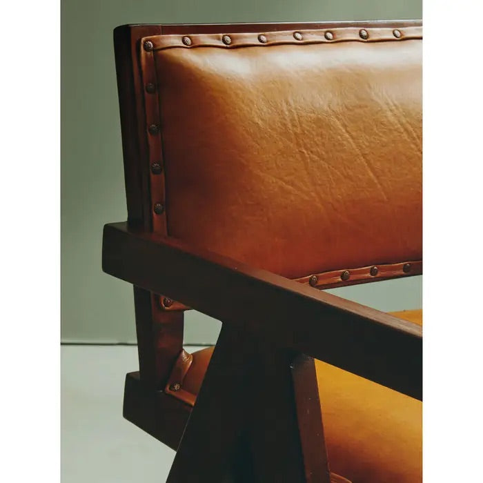 Add refined style to your space with the Andean small armchair. A teak wooden frame, upholstered in soft tan genuine leather and finished with metallic stud detailing. Shop online today at www.nobleandnook.co.uk
