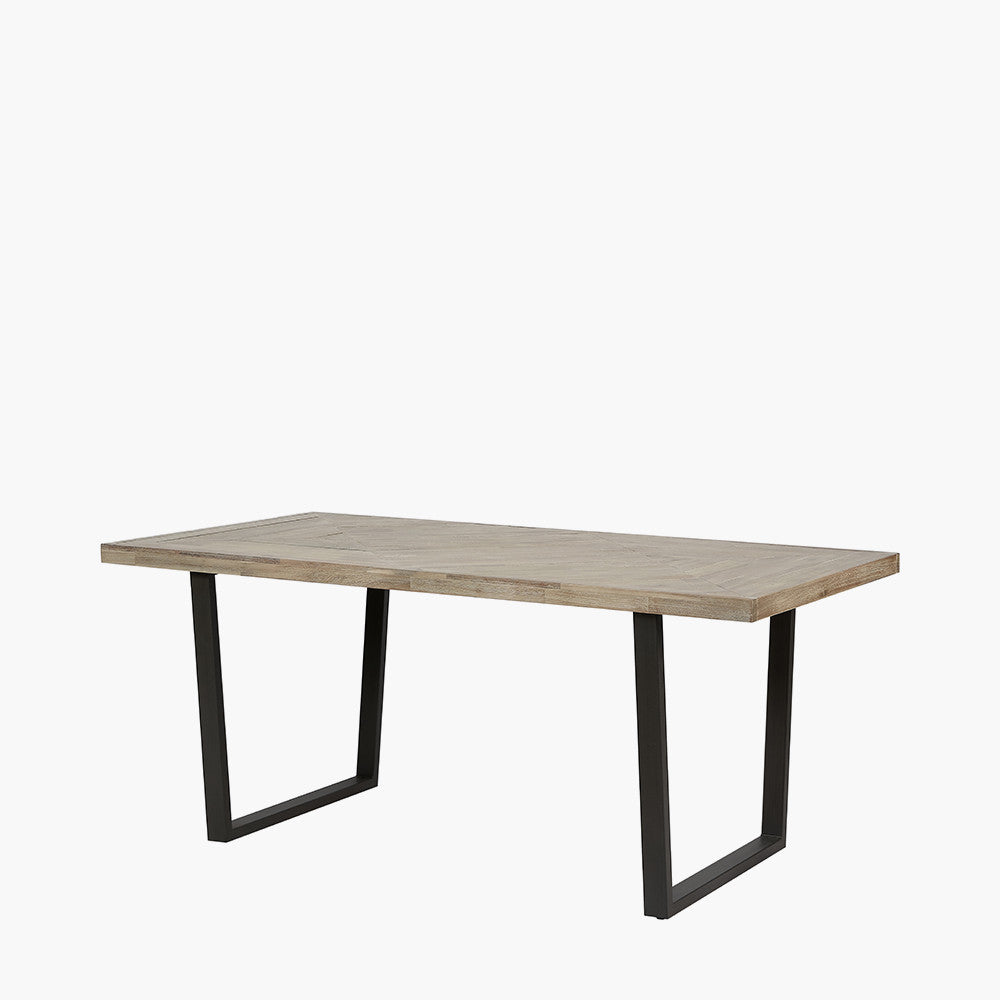 Shop the Marca Sand Wash Dining Table crafted from luxurious Acacia wood with a unique black metal leg design. Shop online now at www.nobleandnook.co.uk