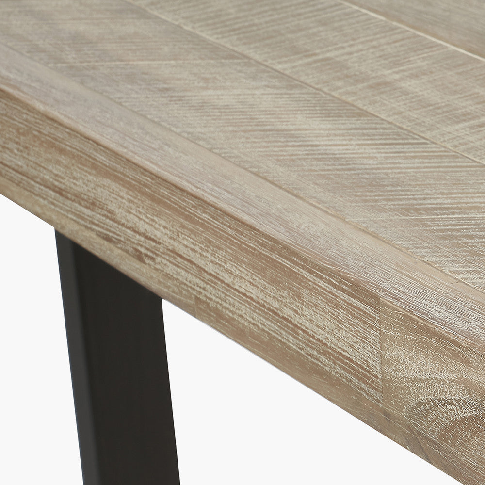 Shop the Marca Sand Wash Dining Table crafted from luxurious Acacia wood with a unique black metal leg design. Shop online now at www.nobleandnook.co.uk