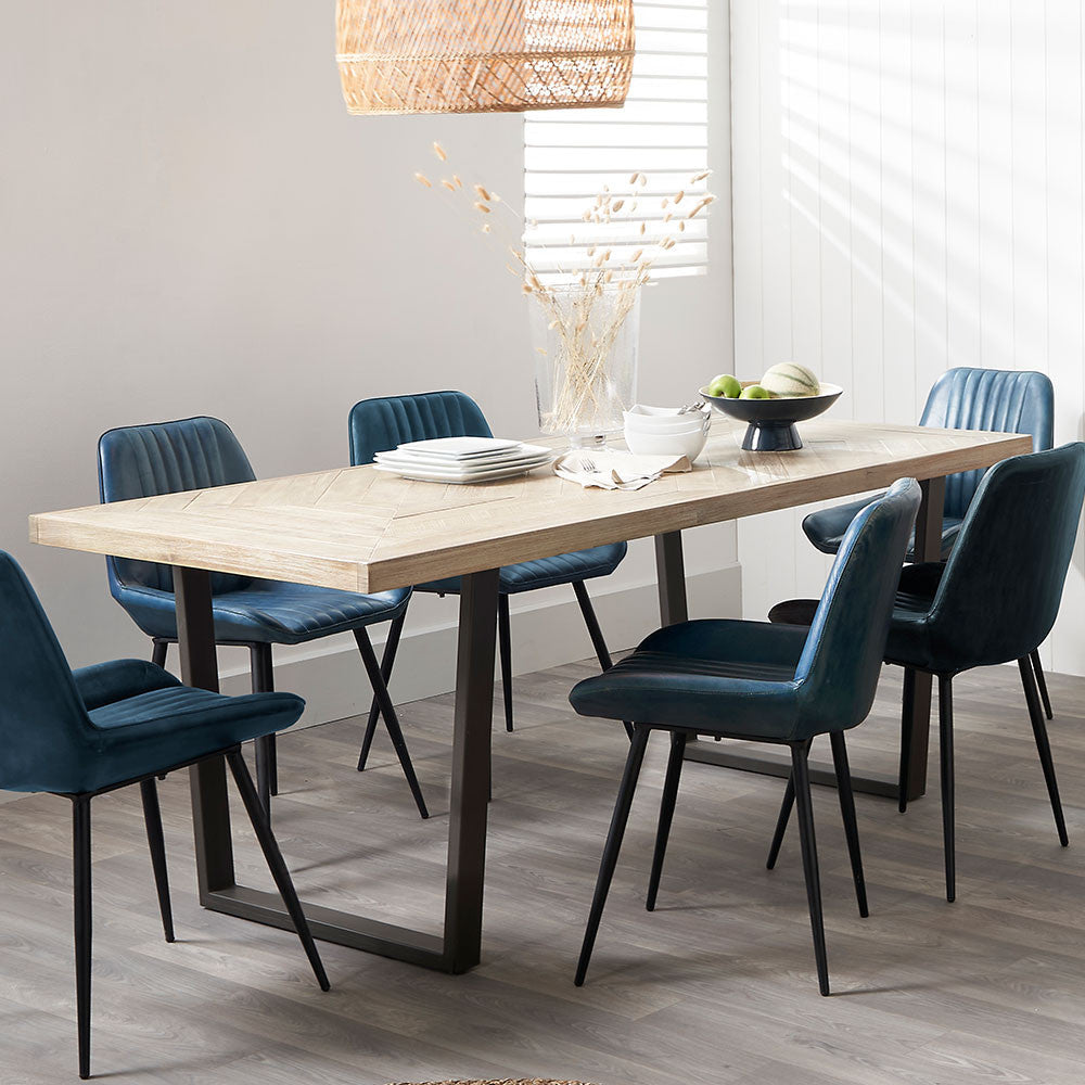 Shop the Marca Sand Wash Dining Table crafted from luxurious Acacia wood with a unique black metal leg design. Shop online now at www.nobleandnook.co.uk