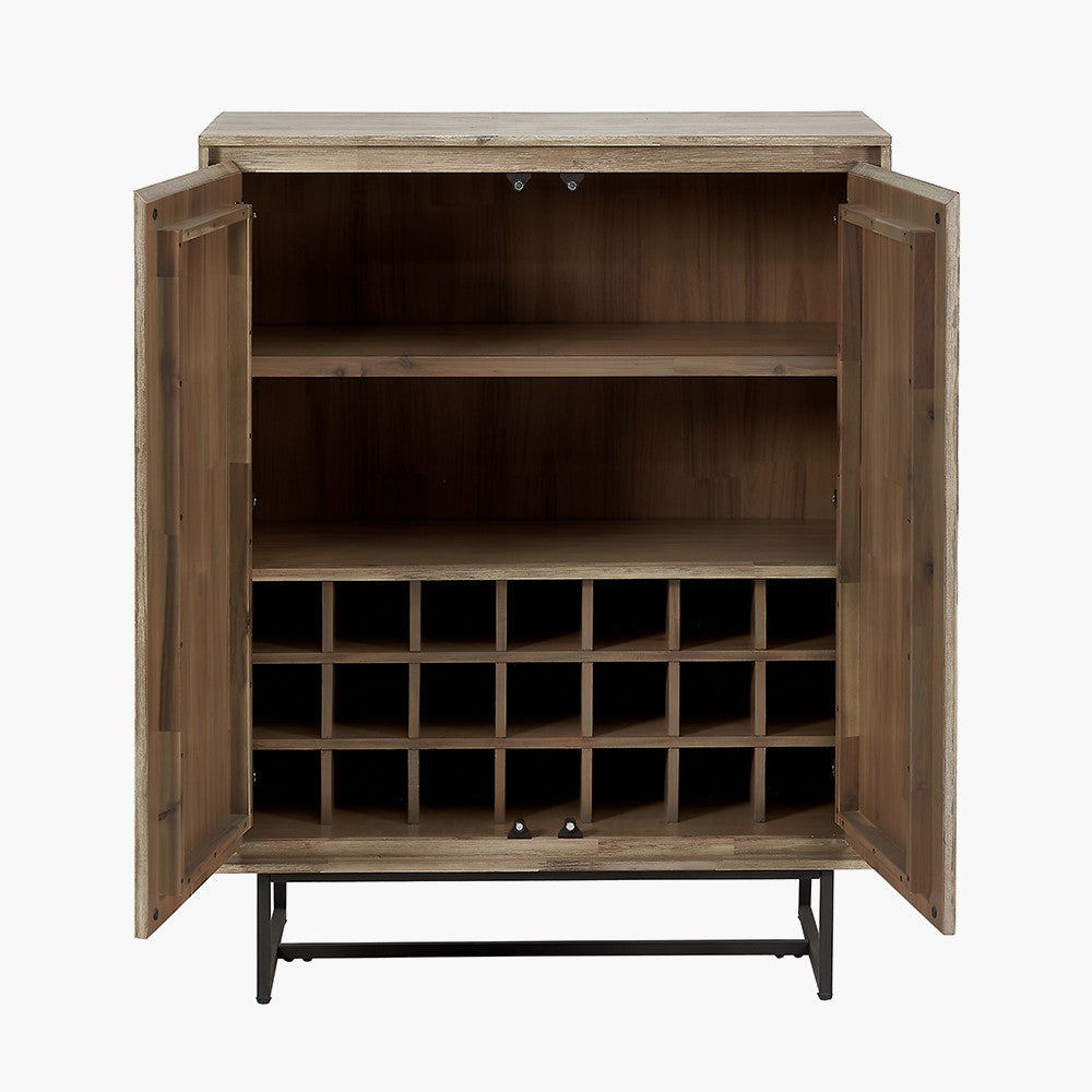 Shop the Marca Bar Cabinet. Crafted from sand-washed acacia wood and sleek black metal. Perfect for stylishly storing your favourite drinks. Shop online today at www.nobleandnook.co.uk