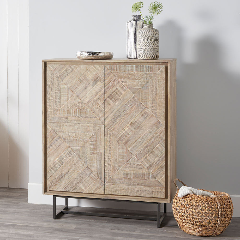 Shop the Marca Bar Cabinet. Crafted from sand-washed acacia wood and sleek black metal. Perfect for stylishly storing your favourite drinks. Shop online today at www.nobleandnook.co.uk
