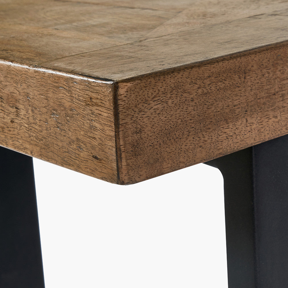 The Pahoja Console Table with an intricate inlaid mango wood top and black black iron legs offering a modern edge, perfect functional accent in any space. Available now at www.nobleandnook.co.uk