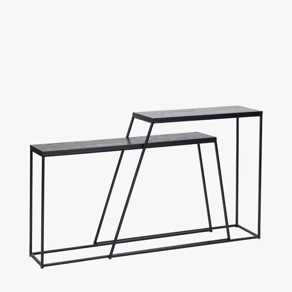 Add bold style and adaptability to your home with the Mashiko Black Ash Veneer and Black Metal Console Tables. Set of two versatile tables with sleek black ash veneer tops. Shop online today at www.nobleandnook.co.uk