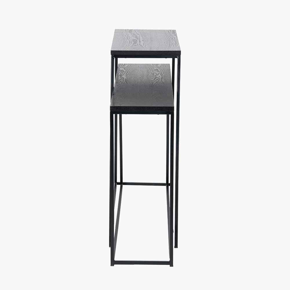 Add bold style and adaptability to your home with the Mashiko Black Ash Veneer and Black Metal Console Tables. Set of two versatile tables with sleek black ash veneer tops. Shop online today at www.nobleandnook.co.uk