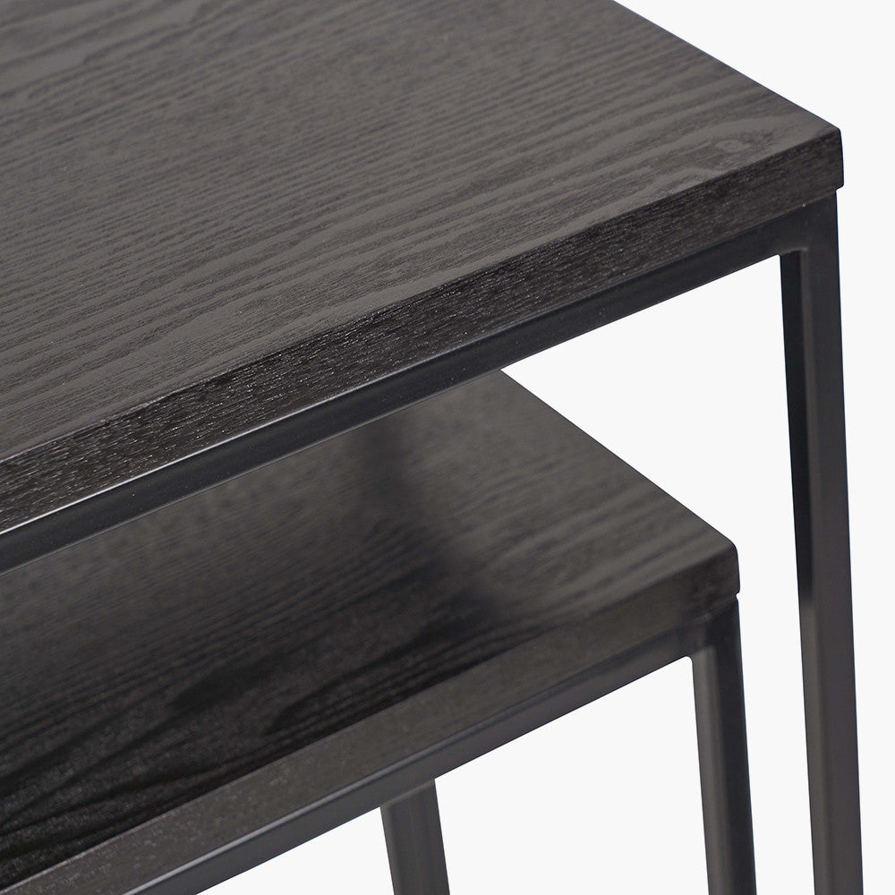 Add bold style and adaptability to your home with the Mashiko Black Ash Veneer and Black Metal Console Tables. Set of two versatile tables with sleek black ash veneer tops. Shop online today at www.nobleandnook.co.uk