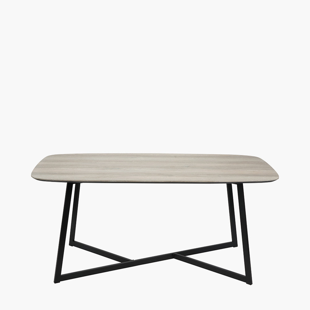 Ukiah Grey Oak Veneer and Black Metal Dining Table, featuring a grey oak veneer top with soft, rounded edges, paired with sturdy black metal legs. W180xD91xH76cm. Available at www.nobelandnook.co.uk