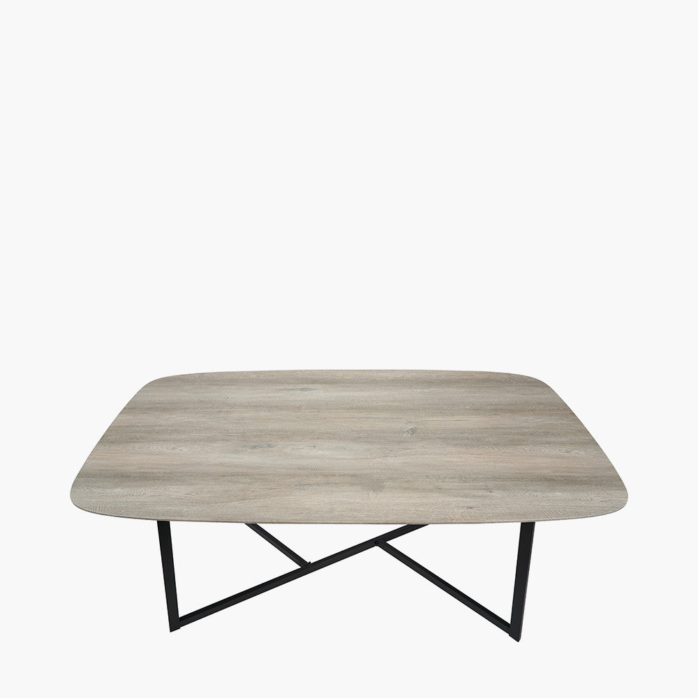 Ukiah Grey Oak Veneer and Black Metal Dining Table, featuring a grey oak veneer top with soft, rounded edges, paired with sturdy black metal legs. W180xD91xH76cm. Available at www.nobelandnook.co.uk