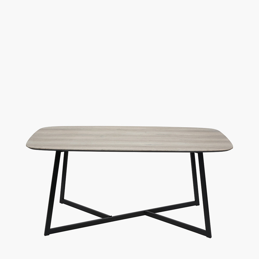 Ukiah Grey Oak Veneer and Black Metal Dining Table, featuring a grey oak veneer top with soft, rounded edges, paired with sturdy black metal legs. W180xD91xH76cm. Available at www.nobelandnook.co.uk
