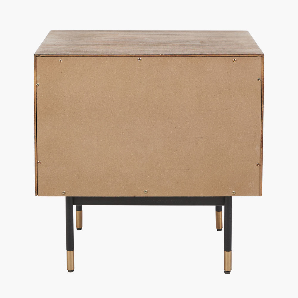 Shop the Arte Bedside Unit in dark brown acacia wood with etched detailing and sleek black metal legs, one drawer and open niche offer ample storage for essentials. Shop online today at www.nobleandnook.co.uk