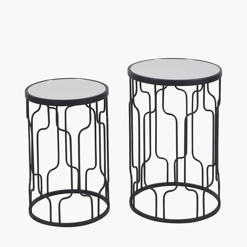 Set of Two Elegant Art Deco Design Side Tables – Includes one large and one small table for versatile styling. Black metal frames with circular silhouettes and mirrored glass tops. Available at www.nobleandnook.co.uk
