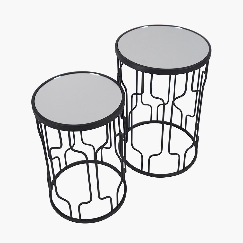 Set of Two Elegant Art Deco Design Side Tables – Includes one large and one small table for versatile styling. Black metal frames with circular silhouettes and mirrored glass tops. Available at www.nobleandnook.co.uk