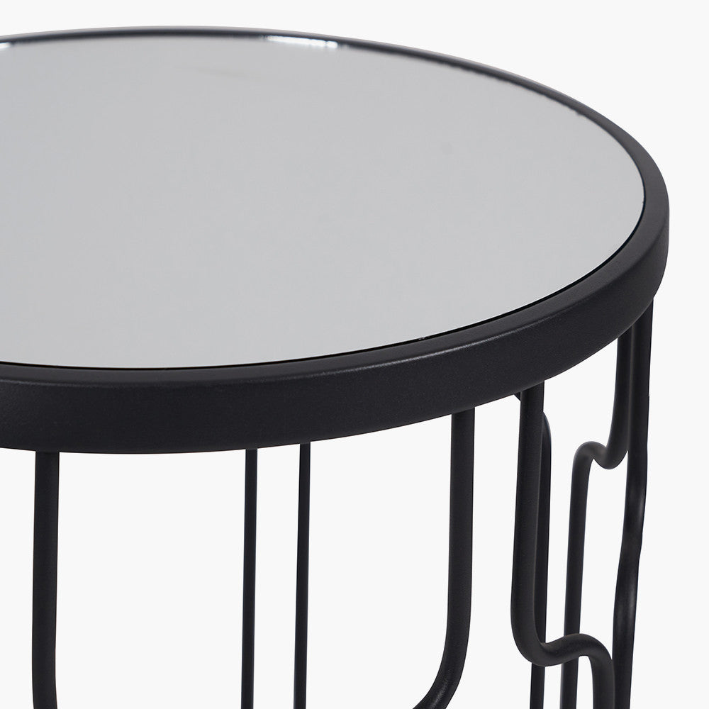 Set of Two Elegant Art Deco Design Side Tables – Includes one large and one small table for versatile styling. Black metal frames with circular silhouettes and mirrored glass tops. Available at www.nobleandnook.co.uk