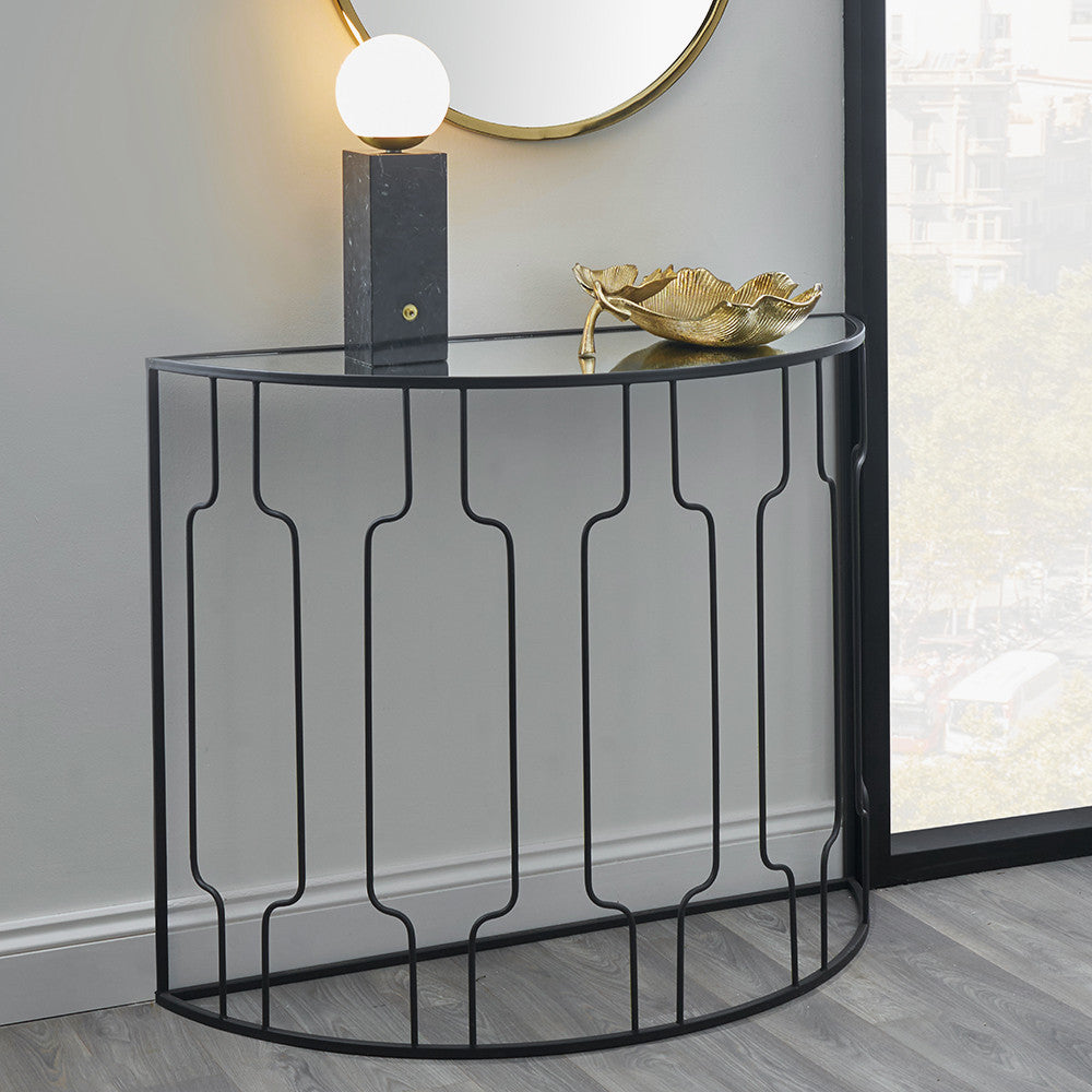 The Caprisse Console Table with its art deco-inspired design and refined half-moon silhouette makes it a standout feature in any room. Whether used in an entryway or behind a sofa. W100 x D40.5 x H81 cm. Shop online today at www.nobleandnook.co.uk