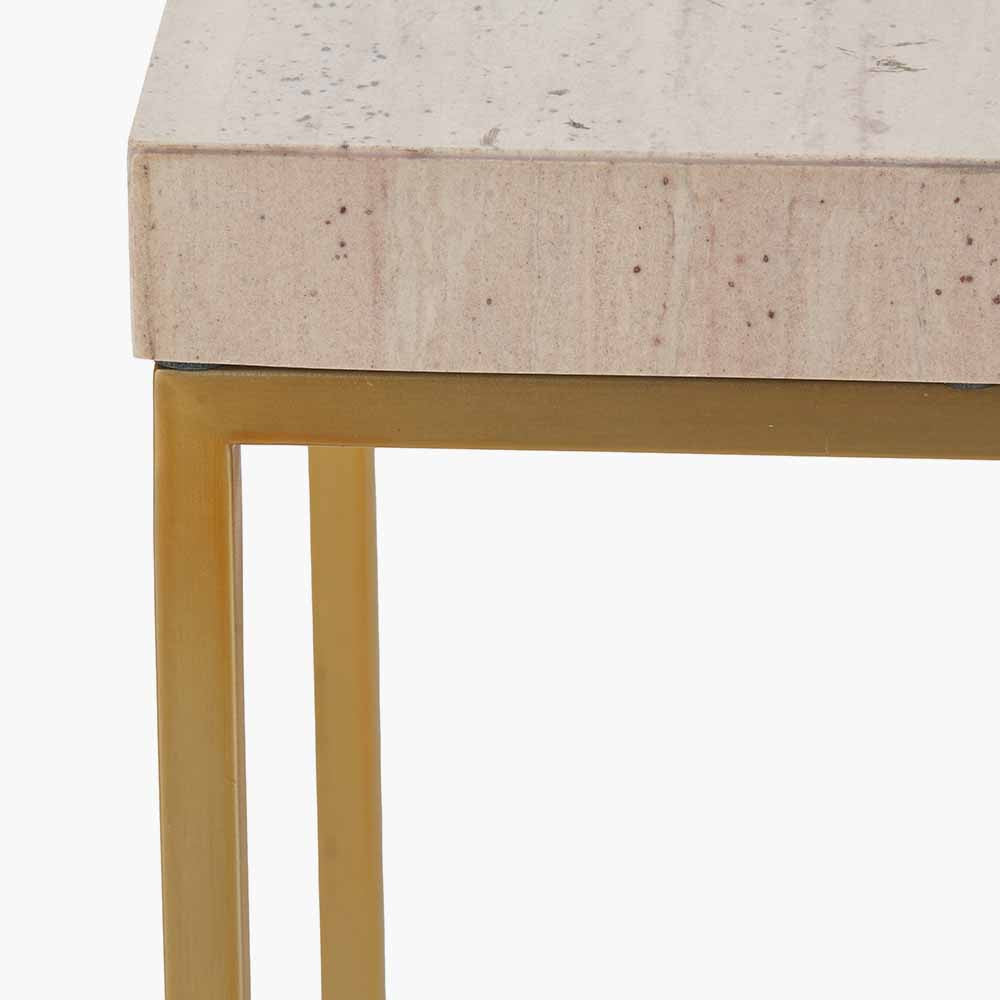 Shop the Madison tall side table, boasting warm burnished gold metal legs and a sophisticated beige granite top, this contemporary piece adds a touch of luxury to any room. Shop online now at www.nobleandnook.co.uk