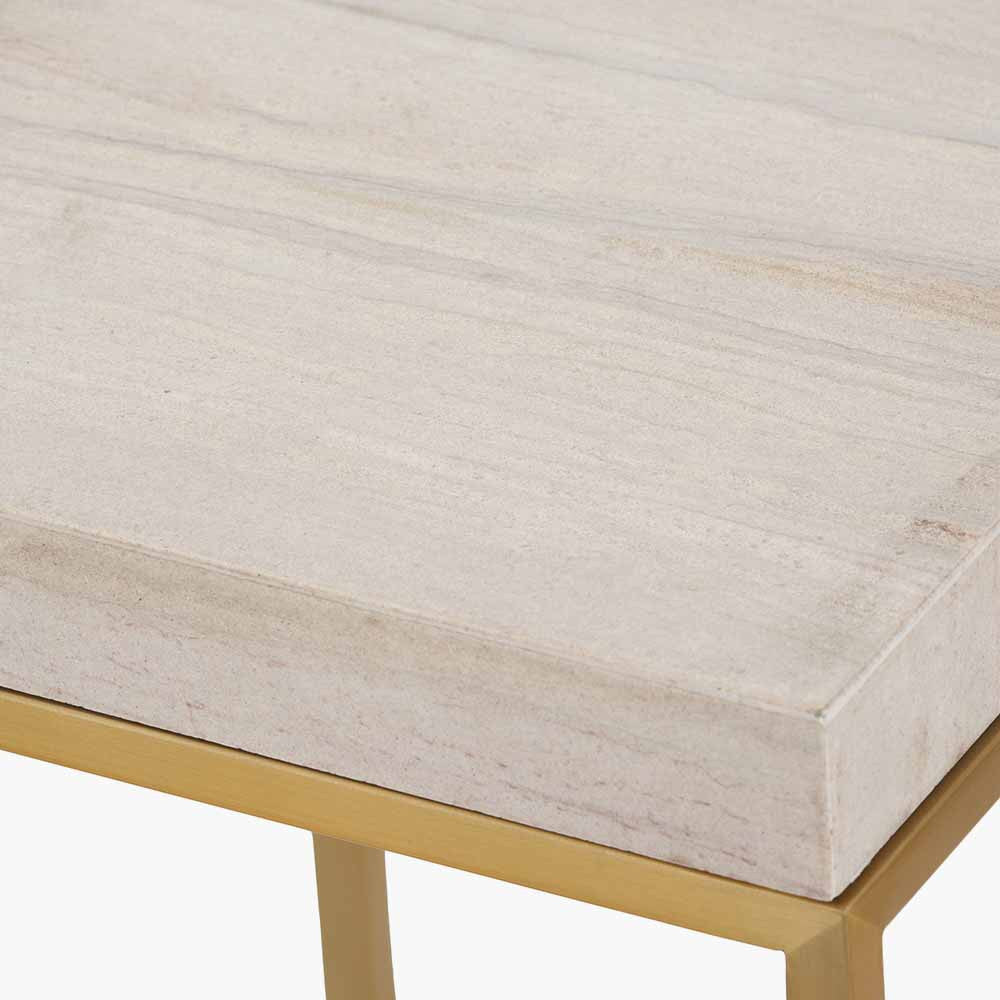 Shop the Madison tall side table, boasting warm burnished gold metal legs and a sophisticated beige granite top, this contemporary piece adds a touch of luxury to any room. Shop online now at www.nobleandnook.co.uk