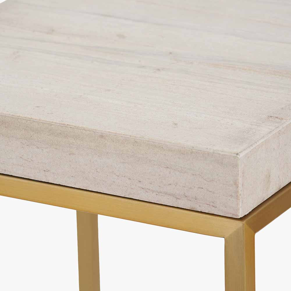 Shop the Madison side table, a contemporary design with warm burnished gold legs and a beige granite top. A luxurious addition to your home decor. Shop online today at www.nobleandnook.co.uk
