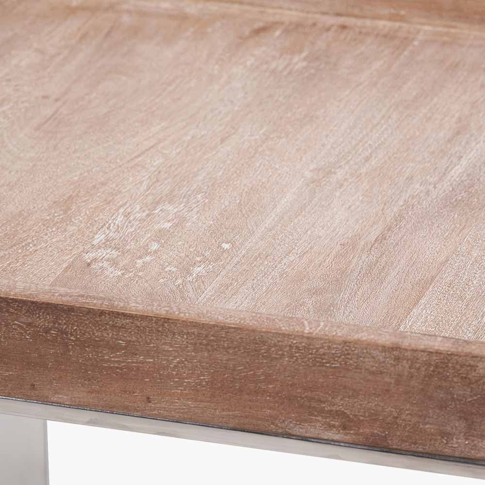 Shop the Evelyn Side Table, featuring a hand-finished antique mango wood top and a polished stainless steel frame. Dimensions W46xD46xH55cm. Shop online today at www.nobleandnook.co.uk