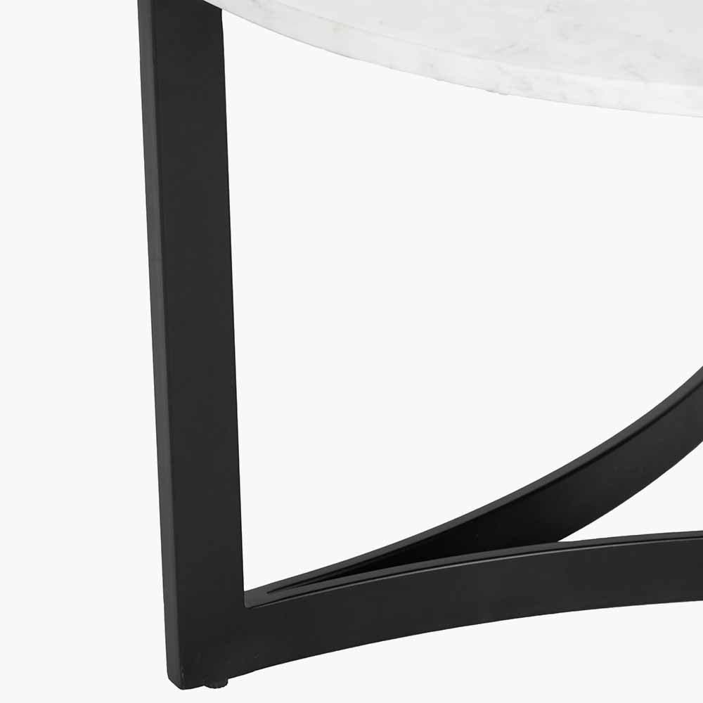 Shop the luxurious Hendrick White Marble & Black Metal Coffee Table featuring a sleek white marble top and curved black metal legs. Shop online now at www.nobleandnook.co.uk