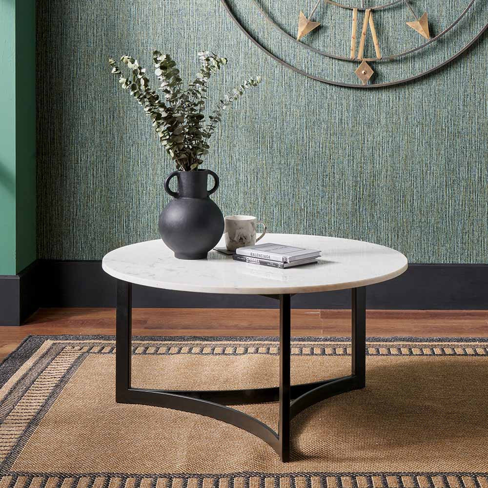 Shop the luxurious Hendrick White Marble & Black Metal Coffee Table featuring a sleek white marble top and curved black metal legs. Shop online now at www.nobleandnook.co.uk