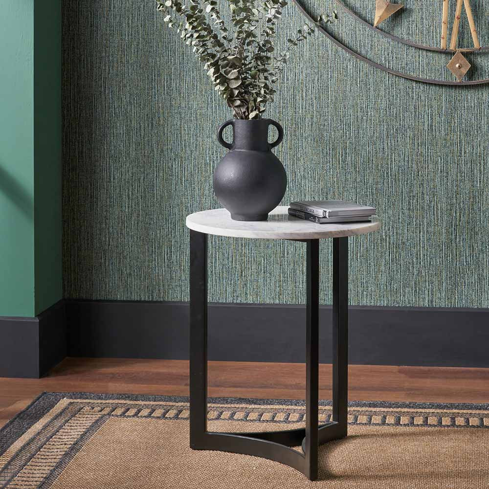 This striking Side Table pairs a luxurious marble top with gracefully curved black metal legs, creating a sophisticated contrast of texture and form. Dimensions W46xD46xH56cm. Shop online today at www.nobleandnook.co.uk
