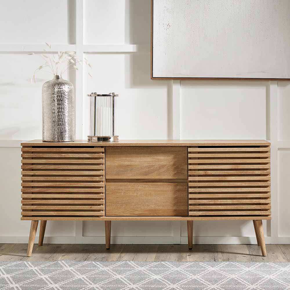 Enhance your living space with the Larvik Natural Wood Sideboard, a perfect blend of Scandinavian-inspired design and practical storage. Shop online today at www.nobleandnook.co.uk