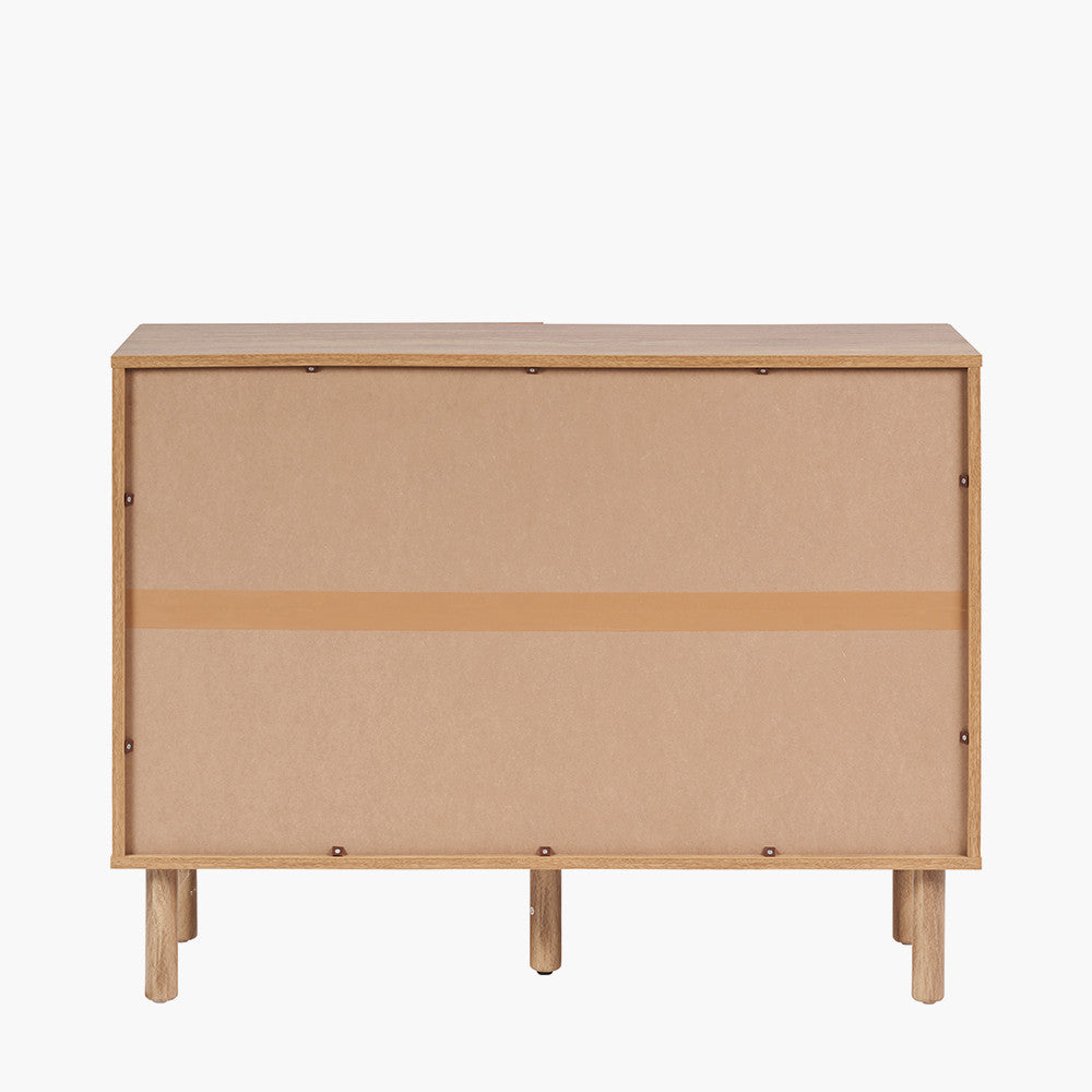 Enhance your space with the Henrik Rattan Cabinet, an elegant piece featuring a textured rattan front, adding warmth and character to any interior. Shop online today at www.nobleandnook.co.uk