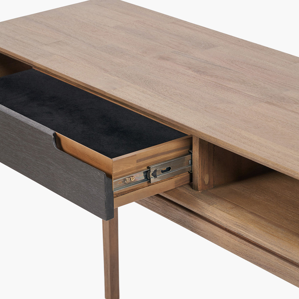 Crafted from solid acacia wood with a striking natural top and black frame, offering a bold, contemporary contrast. Scandinavian-Inspired Design. W120xD40xH80cm. www.nobleandnook.co.uk