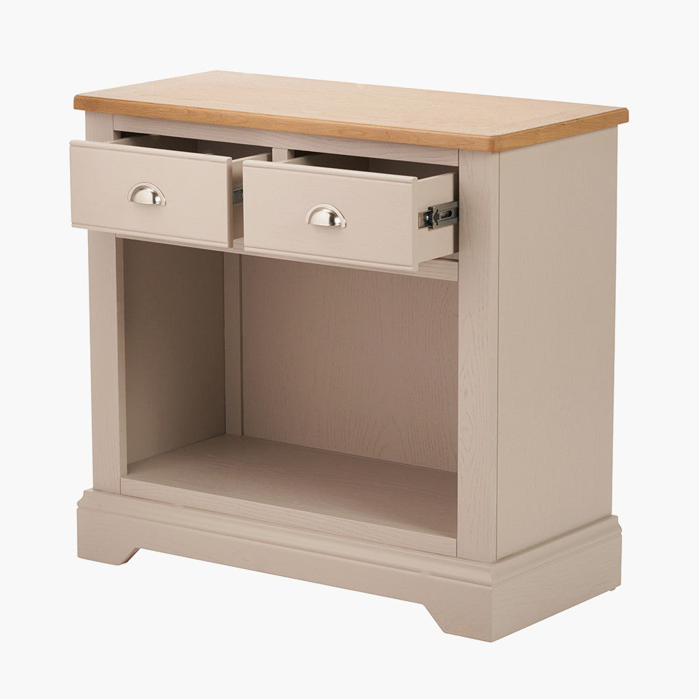 Add timeless country cottage charm to your home with the Fairford 2-Drawer Console Table. Crafted from pine wood with a parchment-white finish and oak-effect top, this elegant table offers practical storage and arrives fully assembled.
