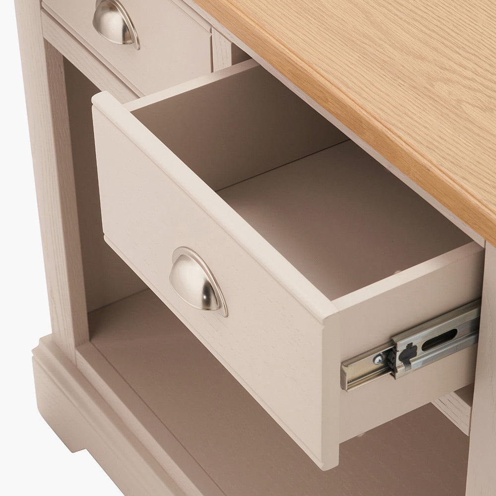 Add timeless country cottage charm to your home with the Fairford 2-Drawer Console Table. Crafted from pine wood with a parchment-white finish and oak-effect top, this elegant table offers practical storage and arrives fully assembled.